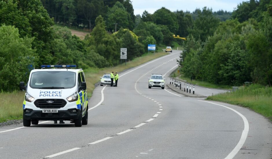 Police at the scene of the crash on the A9.