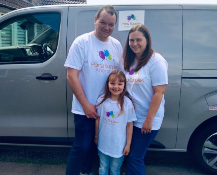 Ryan Coutts and his family standing next to the Party Supplies Aberdeen van.