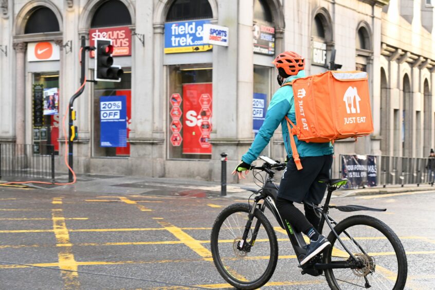 A food delivery cyclist on Union Street - as the behaviour of ebike users on the Granite Mile has been branded "concerning". Image: Paul Glendell/DC Thomson