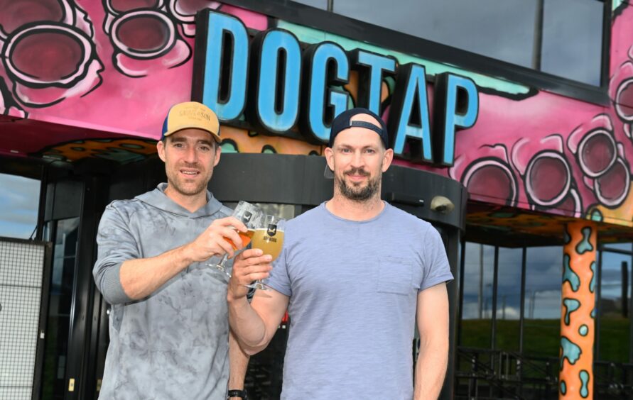 BrewDog co-founders Martin Dickie and James Watt, outside the DogTap bar at the firm's Ellon HQ.