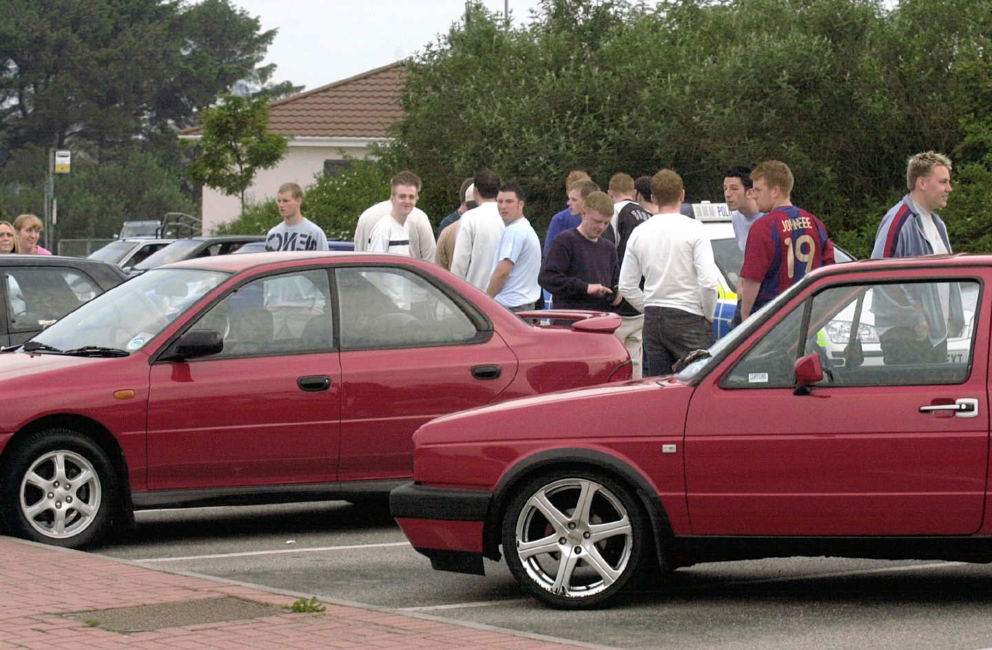 Young drivers admiring each other's cars at the AECC car park in 2004