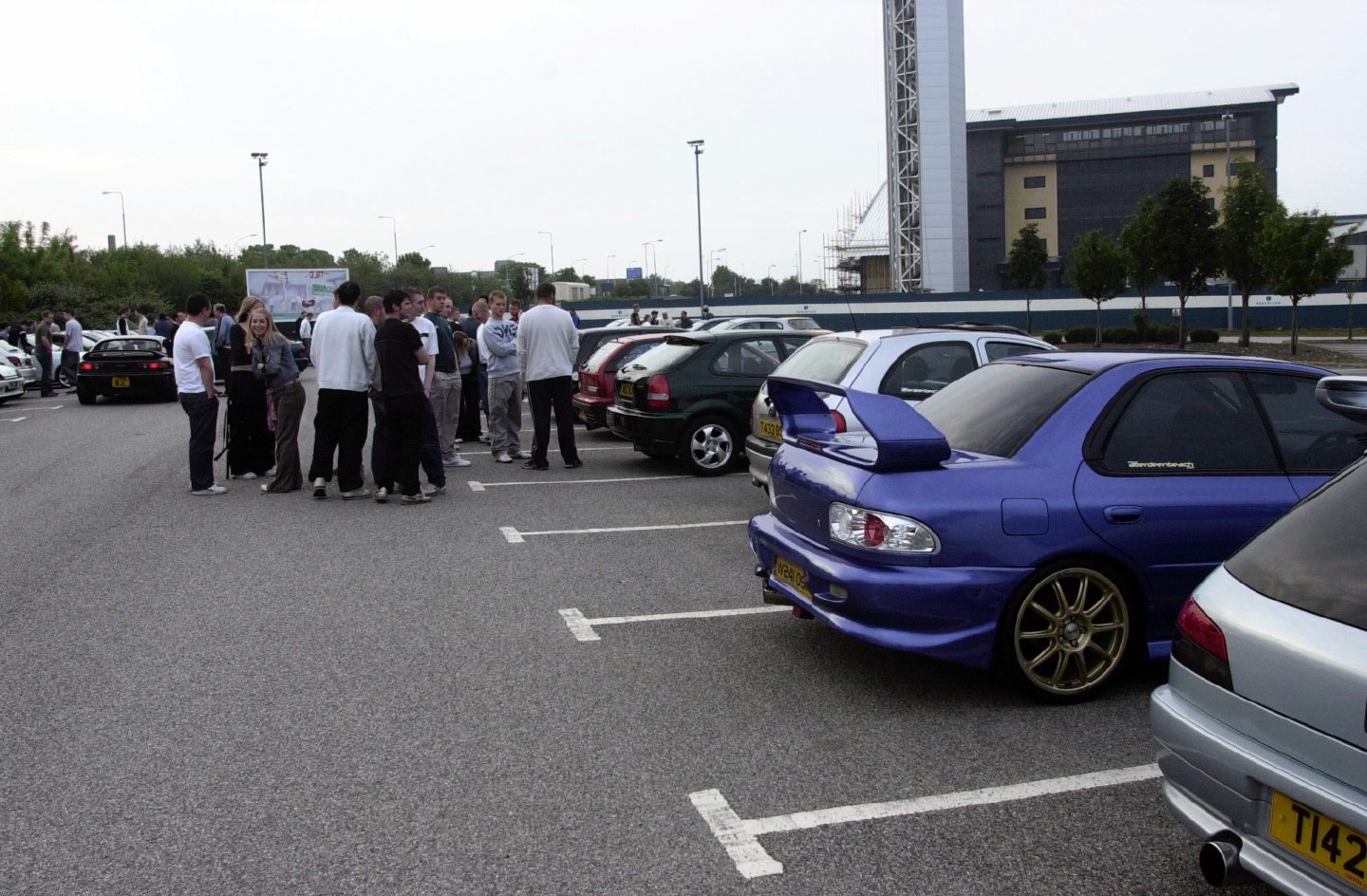 People crowded around some of the cars during a meet-up at the AECC in 2004