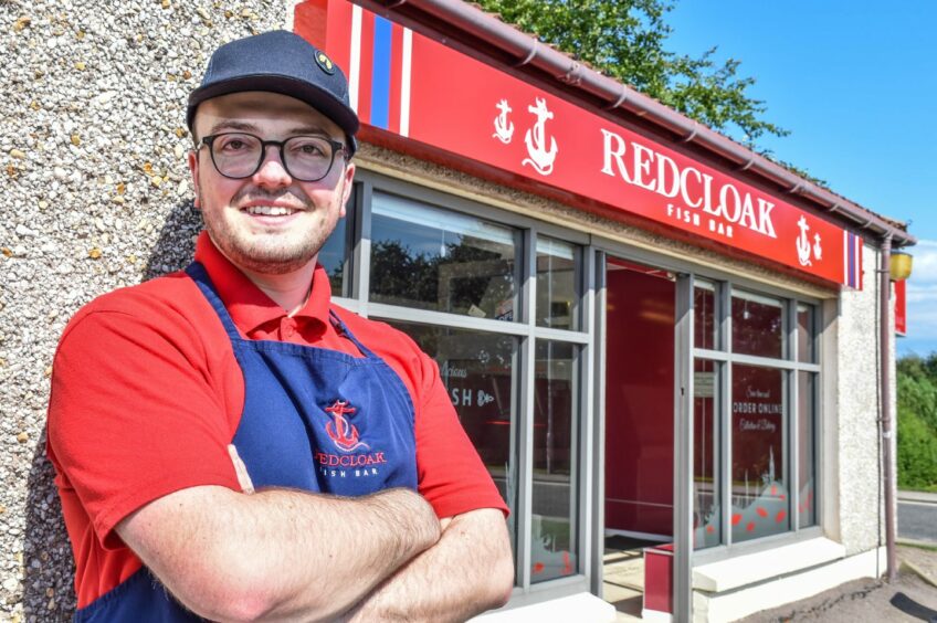 Jamie in front of Redcloak Fish Bar.