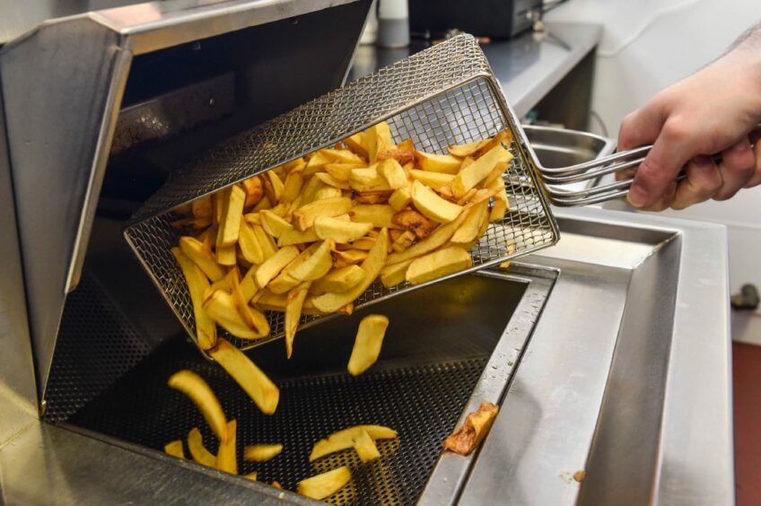 A basket of chips being emptied out
