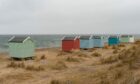 Beach huts at Findhorn Beach.