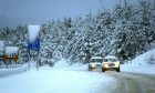 Cars driving in snow on A9