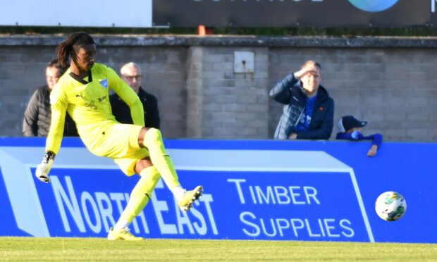 Peterhead goalkeeper Blessing Oluyemi plays a pass in a match against Spartans at Balmoor Stadium.