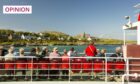Passengers on the Iona ferry (Image: Global Warming Images/Shutterstock)
