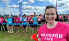 Cancer survivor Jordan Ramsay standing at the starting line at Race for Life Aberdeen.