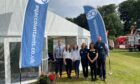 The EQ Accountants team standing next to their tent at the Turriff Show.