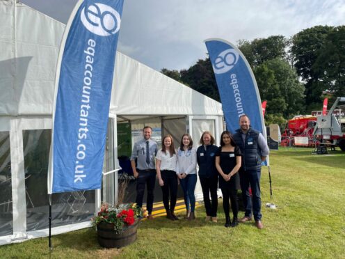 The EQ Accountants team standing next to their tent at the Turriff Show.
