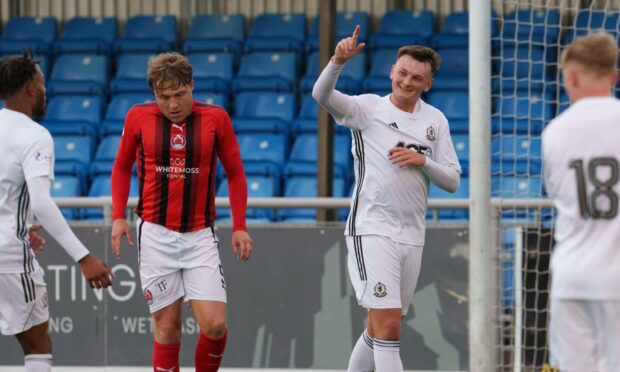Kyle Connell celebrates putting Cove 1-0 up against Clyde. Image: Brian Smith.