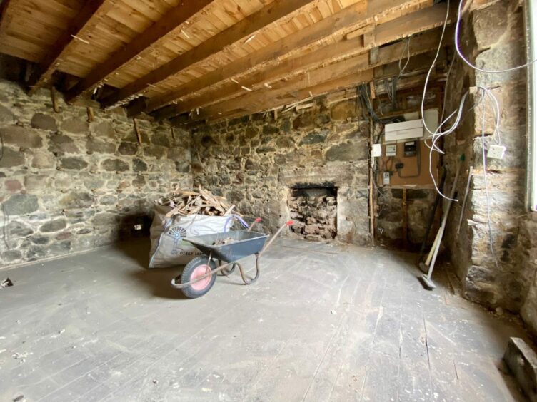 Bare and dusty room in the Banchory cottage before work was carried out.