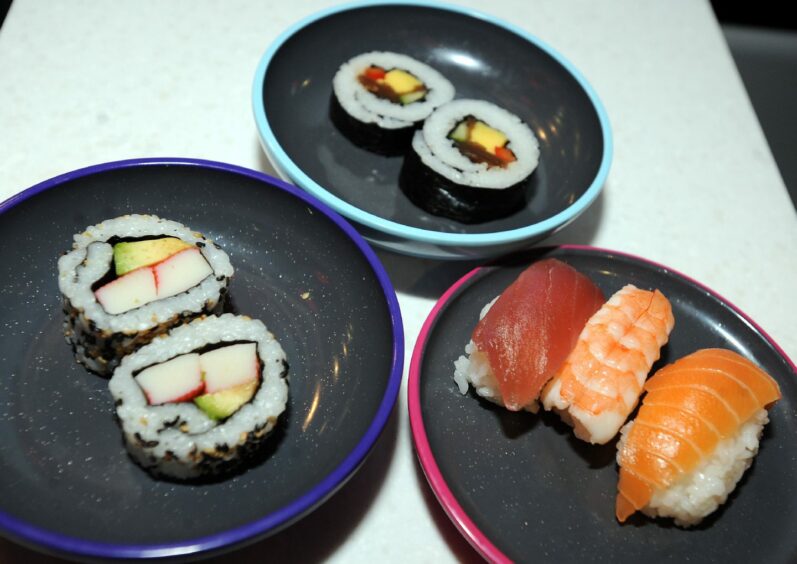 Plates of nigiri and maki from Yo! Sushi.