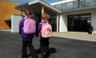Two pupils head to Heathryburn School in Northfield. Image: Colin Rennie/DC Thomson