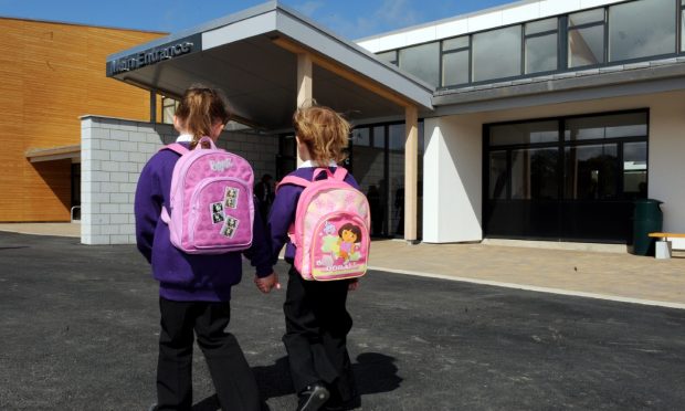 Two pupils head to Heathryburn School in Northfield. Image: Colin Rennie/DC Thomson