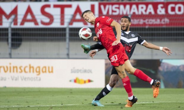 Or Dadia (L) in action for Hapoel Be'er Sheva against Lugano's Hicham Mahou (R) during the Uefa Europa Conference League third qualifying round, first leg clash. Image: Shutterstock