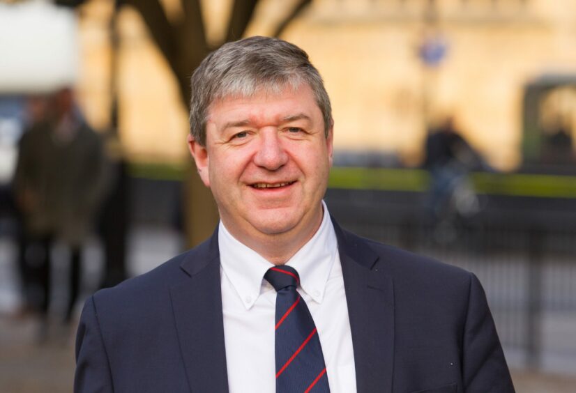 Alistair Carmichael in a suit and tie.