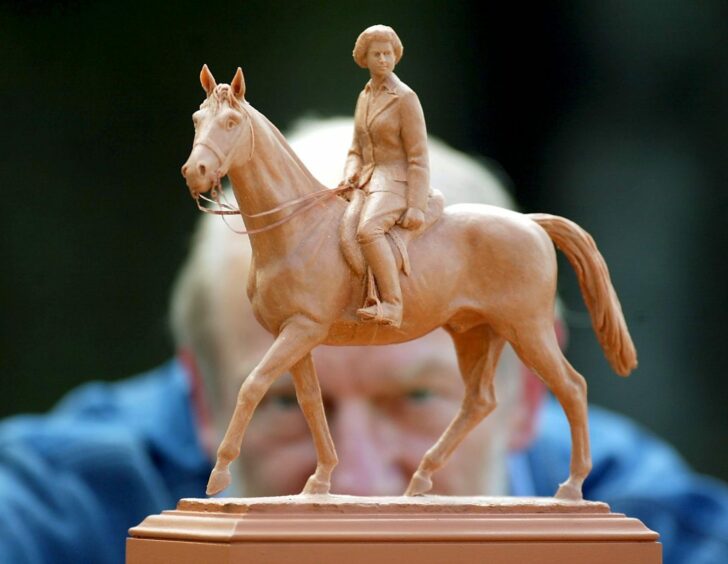 Philip in 2002 with his maquette of his statue of the Queen, commissioned by the Crown Estate to celebrate Queen Elizabeth's Golden Jubilee. 
