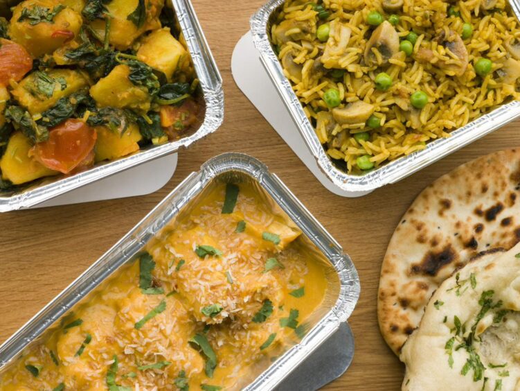 An array of takeaway curries.
