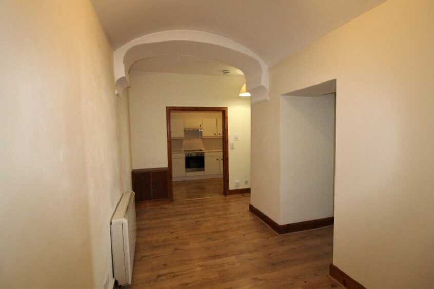 The hallway of the ground floor flat in Dingwall that features one bedroom and makes up a Highland property for sale for under £80K.