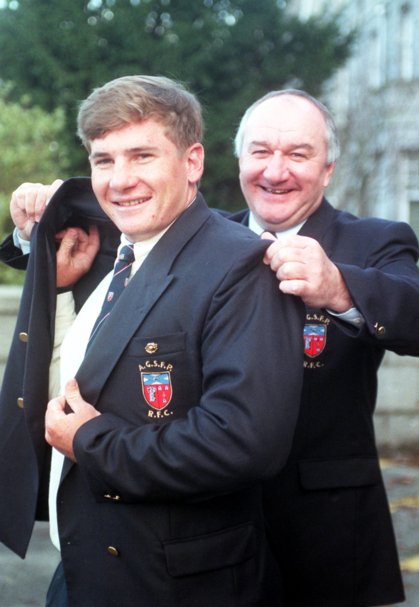  Aberdeen Grammar SChool FP Rugby Clubs new signing, Robert Russell from Australia, receives a helping hand with his blazer from coach Steve Coward in 1998.