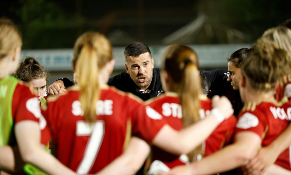 Aberdeen Women manager Clint Lancaster delivers his post-match team talk after the win over Montrose.