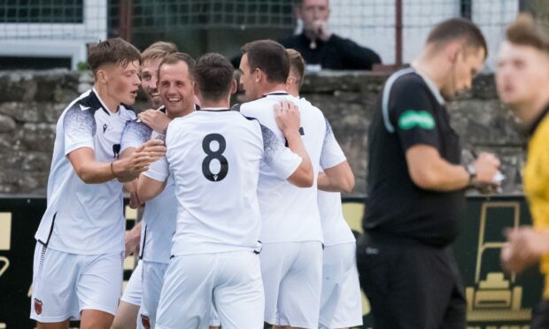 Rothes celebrate after Michael Finnis opens the scoring at Nairn County. Images: Jasperimage