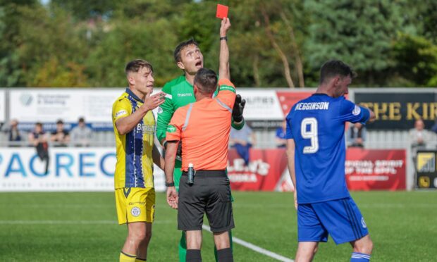 Queen of the South's Gordon Botterill is sent off for spitting at Cove's Mitchel Megginson. Image: Dave Cowe.