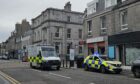 Police and ambulance crews were called to an alleged assault on George Street. Image: Lauren Taylor / DC Thomson.