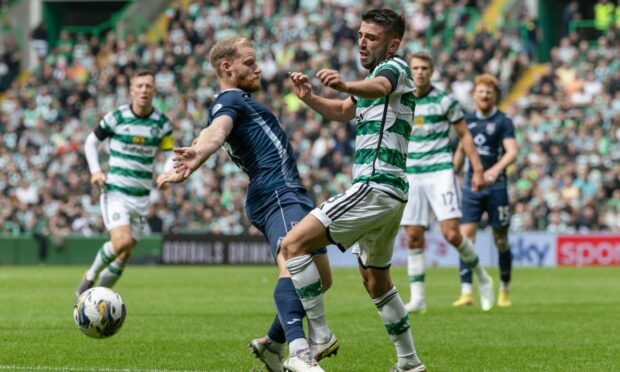 Josh Sims brings down Greg Taylor in the incident which led to Celtic's penalty. Image: SNS