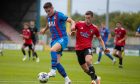 Cameron Harper in action for Caley Thistle against Queen's Park. Image: SNS