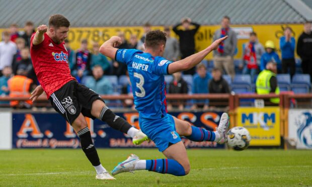 Dom Thomas puts Queen's Park ahead at Inverness. Images: Craig Brown/SNS Group
