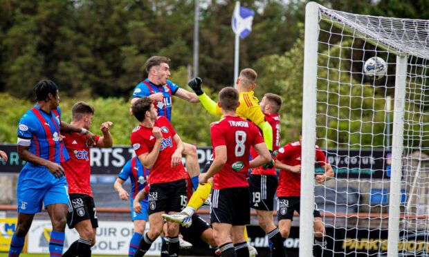 Jake Davidson crashes home his headed goal against Queen's Park, but it wasn't enough to prevent a 2-1 defeat. Image: Craig Brown/SNS Group