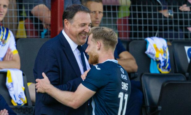 Malky Mackay with Ross County winger Josh Sims. Image: SNS