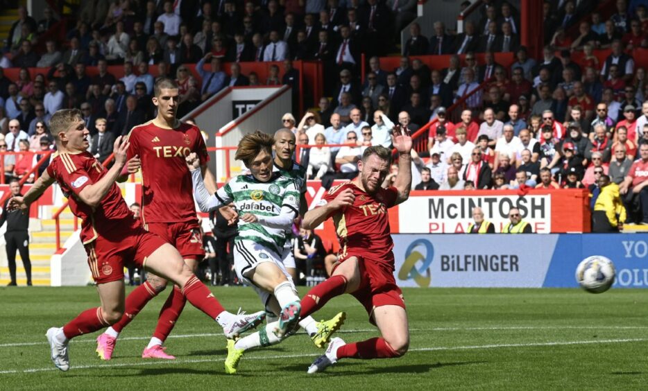 ABERDEEN, SCOTLAND - AUGUST 13: Celtic's Kyogo Furuhashi scores to make it 2-1 during a cinch Premiership match between Aberdeen and Celtic at Pittodrie Stadium, on August 13, 2023, 