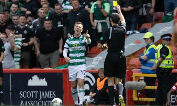 Callum McGregor complains to referee Kevin Clancy after he is shown a yellow card during a cinch Premiership match between Aberdeen and Celtic at Pittodrie. Image: SNS.