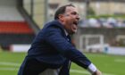 Ross County manager Malky MacKay celebrates at full time after the win against Airdrieonians. Image: SNS.