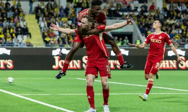 Aberdeen's Nicky Devlin celebrates with teammates after making it 2-2 against BK Hacken in Gothenburg on Thursday. Image: SNS.