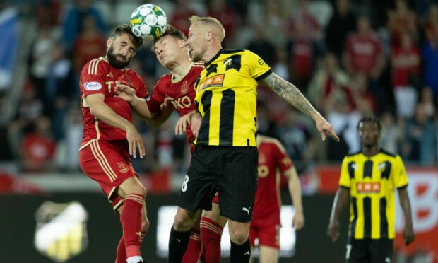 BK Hacken's Mikkel Rygaard and Aberdeen's Graeme Shinnie and James McGarry during Thursday's Europa League play-off first leg match in Gothenburg. Image: SNS.