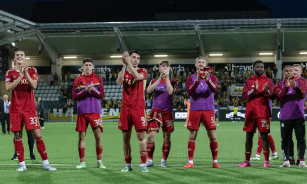 Aberdeen players applaud the fans at full-time after their 2-2 comeback draw against BK Hacken in their Europa League play-off first leg in Gothenburg, Sweden. Image: SNS.