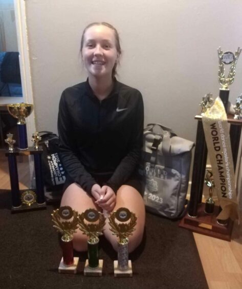 Alisha Coates with her trophy collection