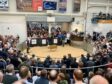 A packed ringside of buyers and spectators watch on as Jim Innes sells his tup lamb for 100,000gns.