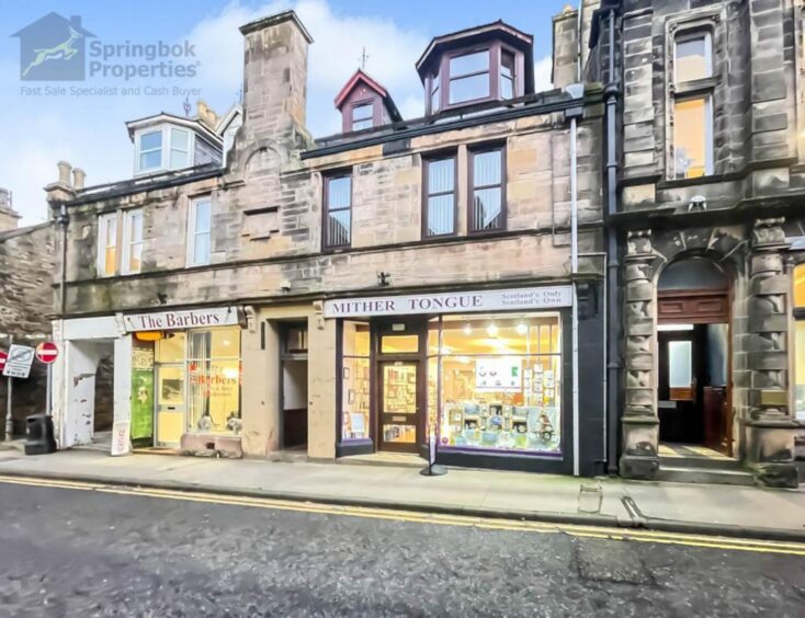 The apartment above a shop in Keith features four bedroomed and makes up a Moray property for sale for under £80K.