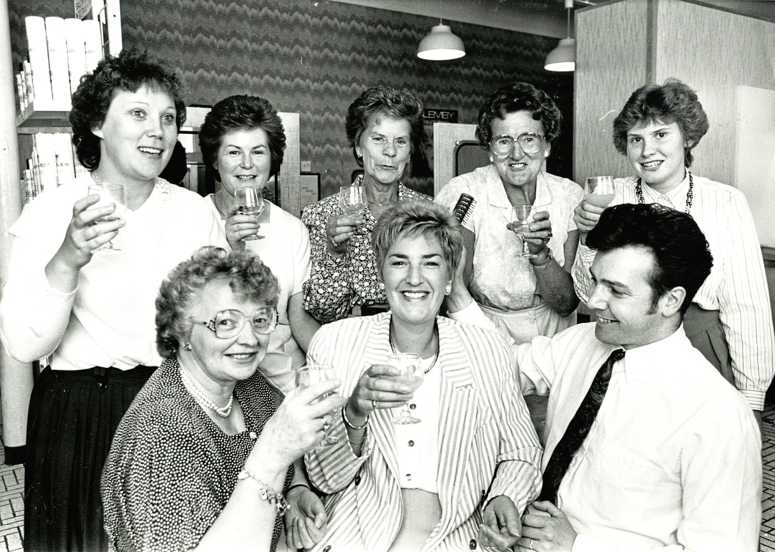 Robert, manager of the Glemby Hair Salon at Esslemont and MacIntosh, poses with regional winners in a national competition showing off their hairdos in 1990.