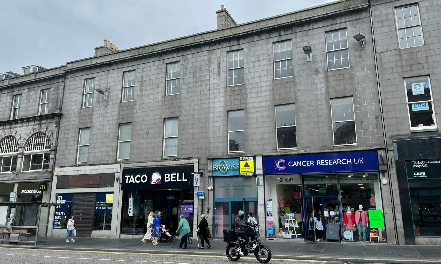 The street also contains a Taco Bell branch, a closed bra shop and a Cancer Research charity shop - all sandwiched between two other empty units.