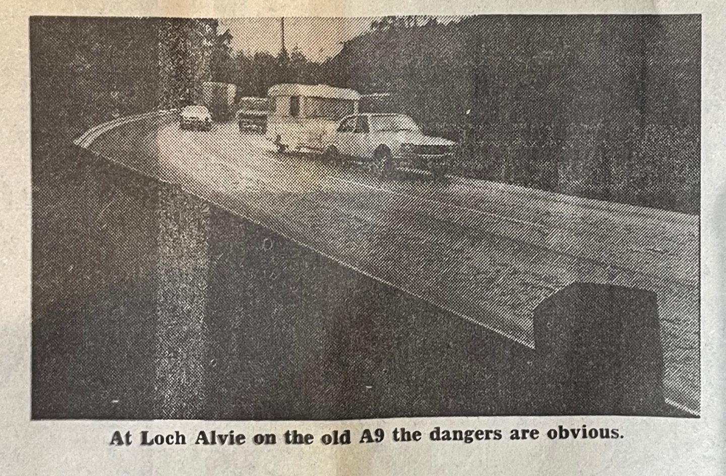 Traffic on the old A9 at Loch Alvie. The caption reads 'At Loch Alvie on the old A9 the dangers are obvious.