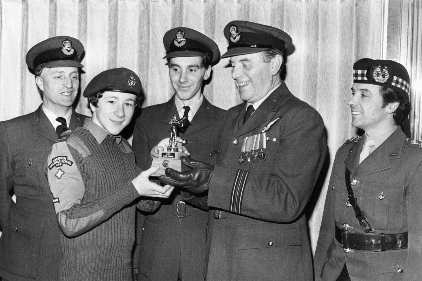 Corporal James Urquhart receives a special trophy, won in a shooting competition, to mark the 40th anniversary of Aberdeen Grammar School's ATC squadron 1299.