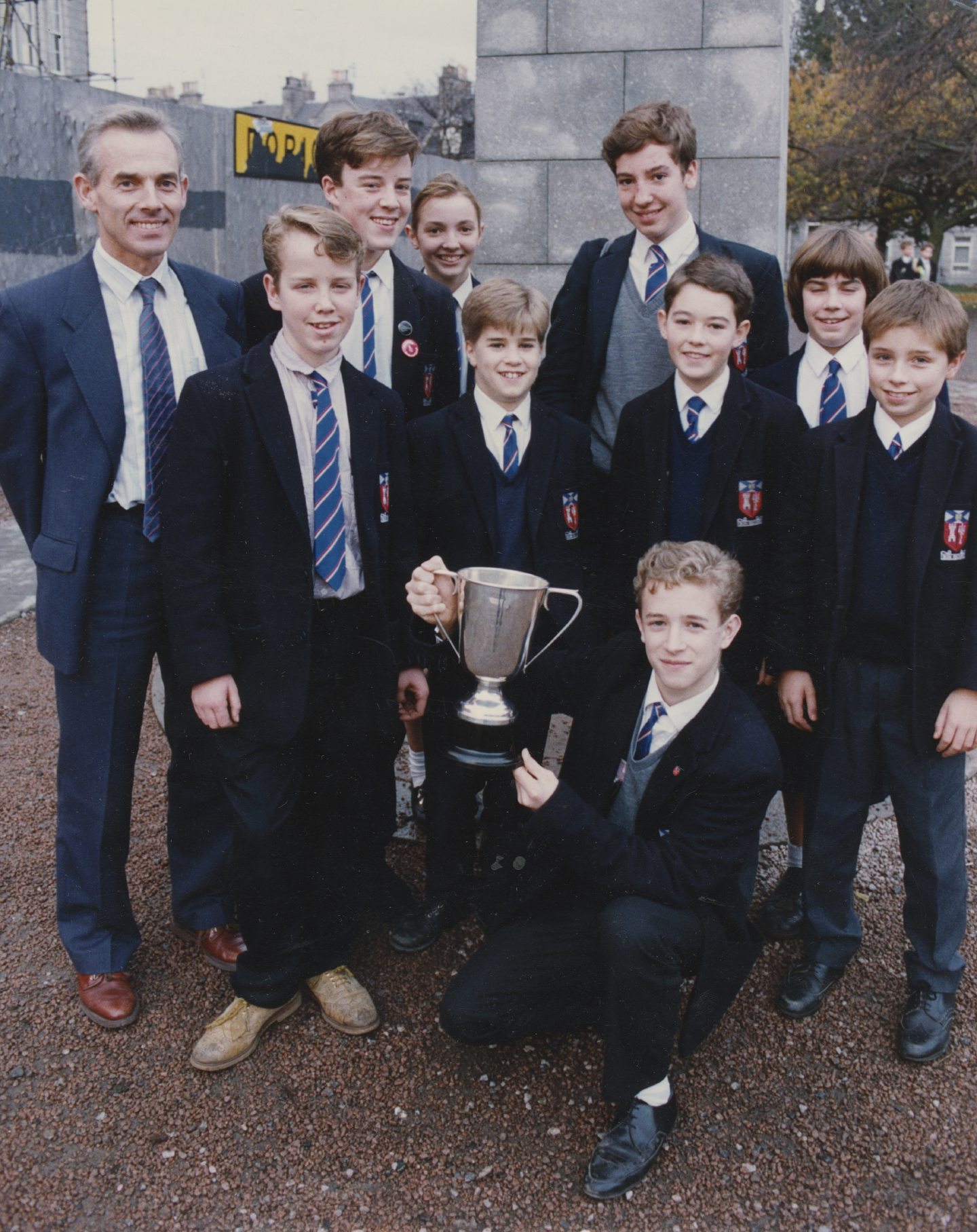 Aberdeen Grammar School's chess team holds up the Scottish jamboree team championship trophy in 1990.