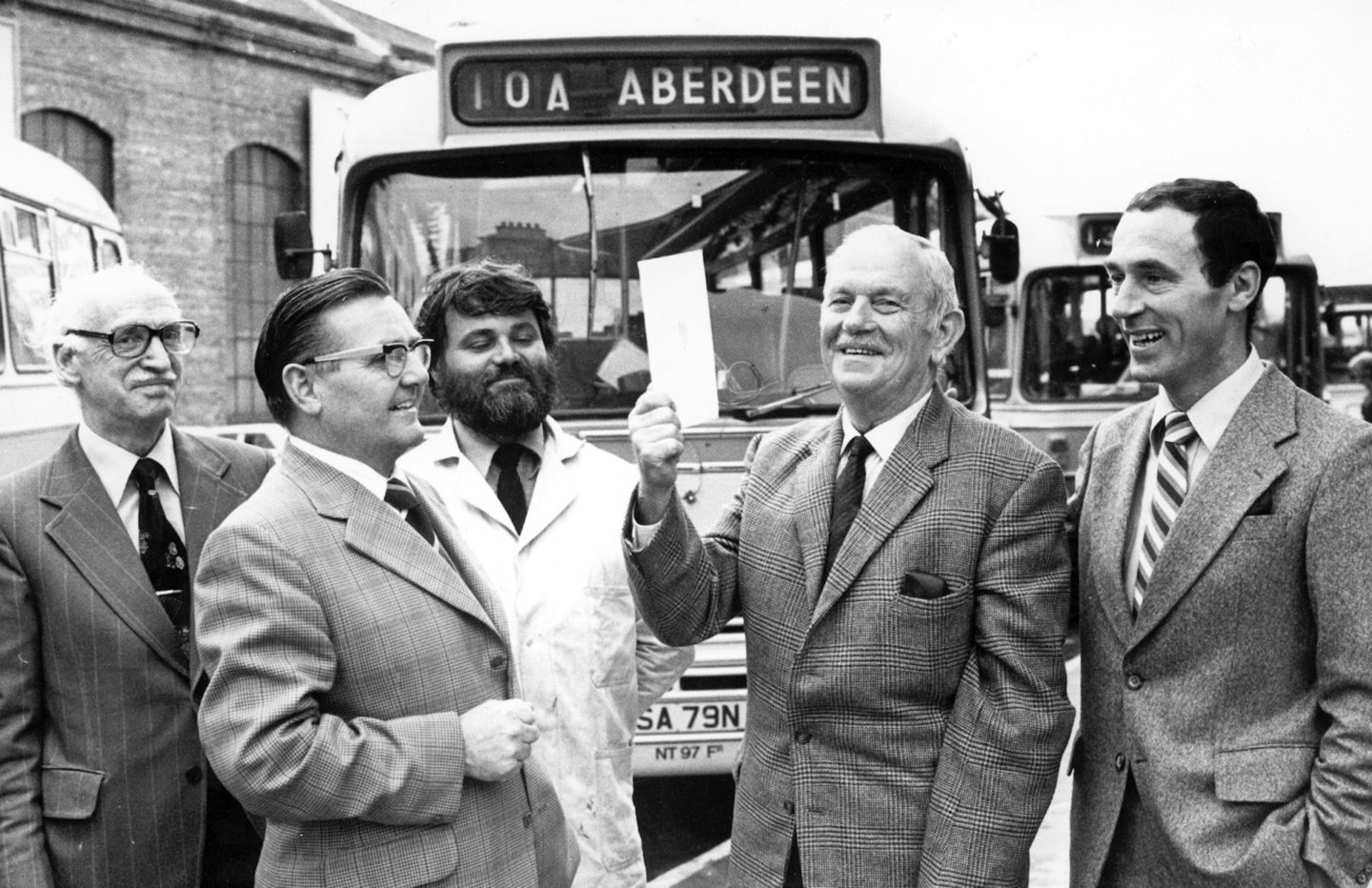 Aberdeen man William Anderson receives a cheque to mark his retirement after 41 years' service with William Alexander and Sons (Northern) Ltd in 1979.